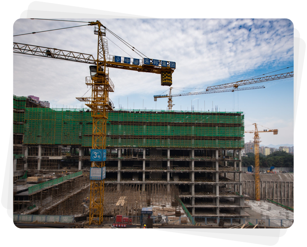 Yellow tower crane at construction site